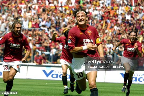 Roma's captain Francesco Totti jubilates after scoring the first goal against Parma during the last day of the First Italian League at Rome's Olympic...