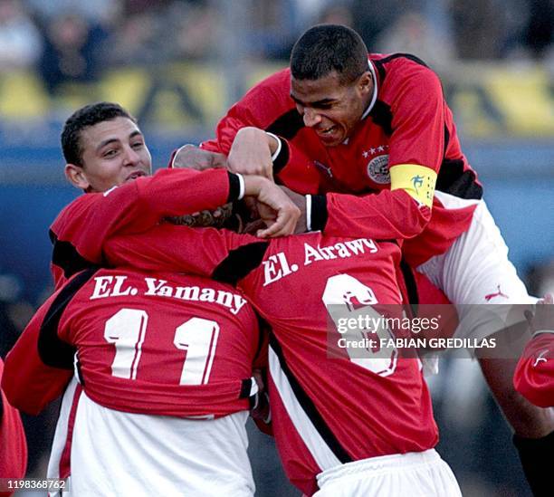 Mohamed El Yamany is embraced by teammates after scoring Egypt's second goal against the US during their World Cup Sub-20 Championship Soccer match...