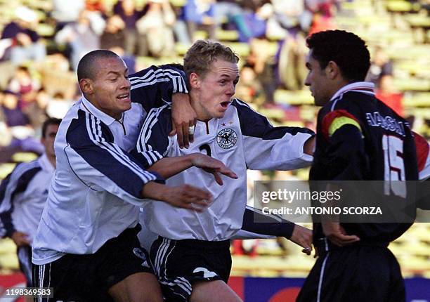 German soccer player Christoph Preuss celebrates a goal with teammate Jermaine Jones as Iraqi Atea Hassan looks on during the World Youth Football...