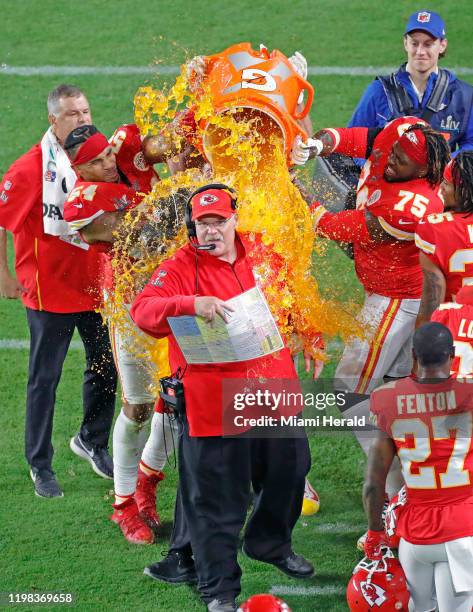 Players dunk Kansas City Chiefs head coach Andy Reid with Gatorade after they defeated the San Francisco 49ers at Super Bowl LIV at Hard Rock Stadium...