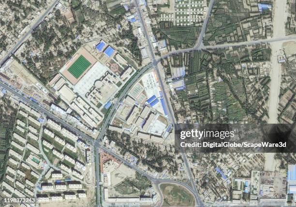 Maxar satellite imagery of a re-education internment camp in Hotan, Xinjiang, China for the purpose of indoctrinating Uyghurs since 2017. Please use:...