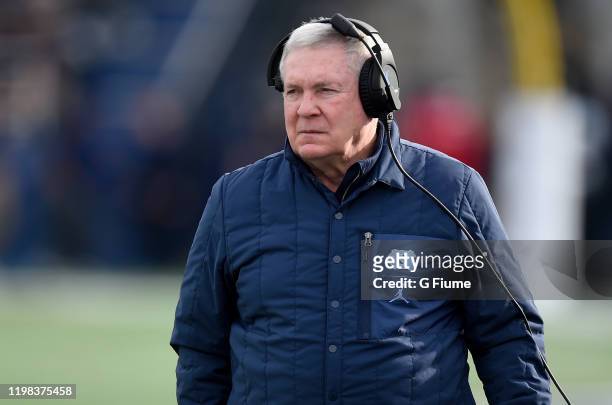 Head Coach Mack Brown of the North Carolina Tar Heels watches the game against the Temple Owls in the Military Bowl Presented by Northrop Grumman at...