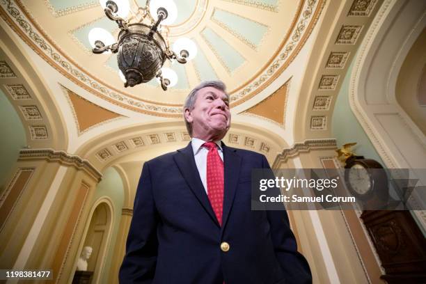 Senator Roy Blunt talks to reporters just off the Senate floor during a recess in the Senate impeachment trial of President Donald Trump on February...