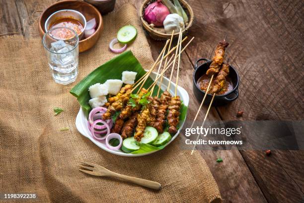 famous indonesian and malaysian street food "satay". - chicken satay stock pictures, royalty-free photos & images