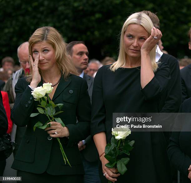 Norway's HH Princess Martha Louise and HRH Norway's Crown Princess Mette-Marit react while listening to a speech as hundreds of thousands of people...