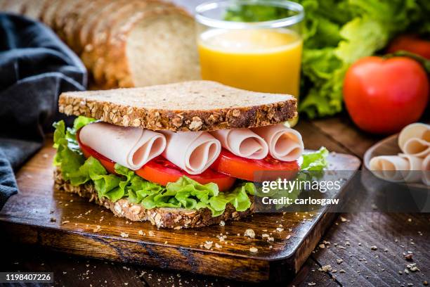 ham, tomatoes and lettuce sandwich - whole wheat sandwich stock pictures, royalty-free photos & images