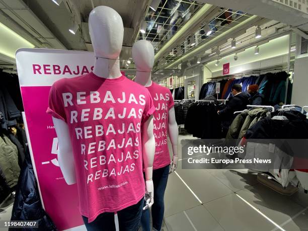Inside a fashion store of Madrid where two dummies wear a sweatshirt in which read 'Rebajas' on January 09, 2020 in Madrid, Spain.
