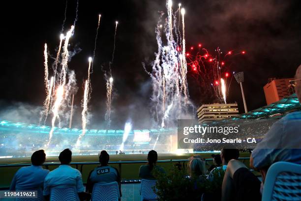 Fans enjoy fireworks at the innings break during the Big Bash League match between the Brisbane Heat and the Hobart Hurricanes at the Gabba on...