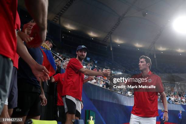 Russian team captain Marat Safin celebrates after Daniil Medvedev of Russia won his quarter final singles match against Diego Schwartzman of...