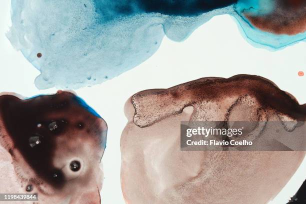 watercolor paint puddles leaked on white surface - brown watercolor stock pictures, royalty-free photos & images