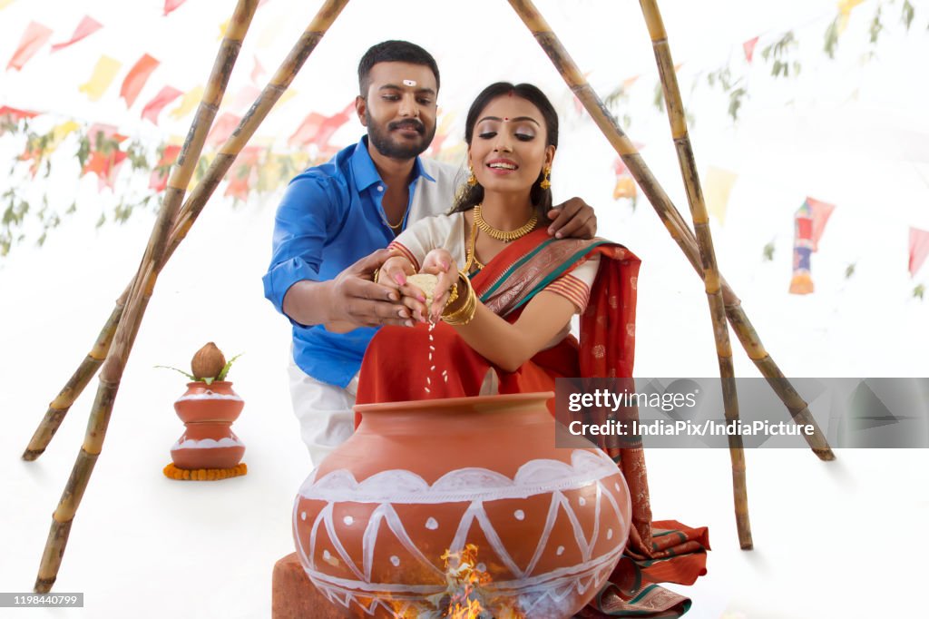 Husband and  wife celebrating pongal