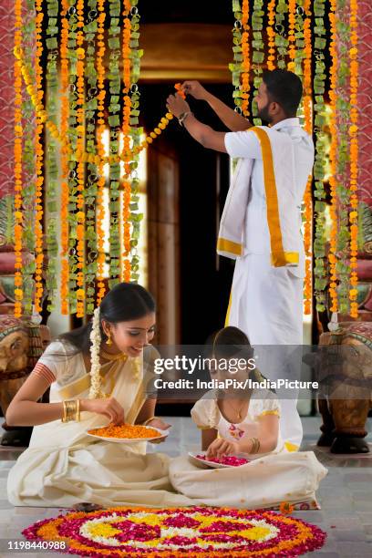 south indian family celebrating onam - onam stock pictures, royalty-free photos & images