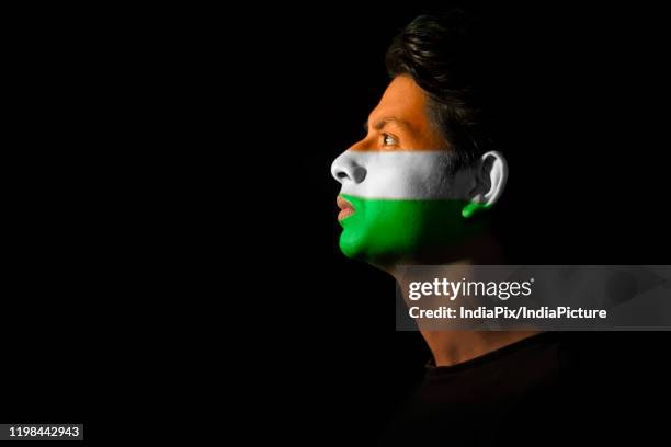 tricolour painted on a mans face, independence day - indian tricolor stock pictures, royalty-free photos & images