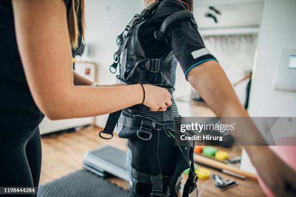 getting ready for ems workout - electrode stock pictures, royalty-free photos & images