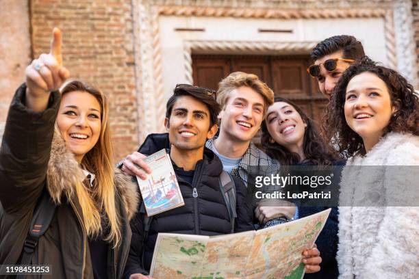 tourist students visit venice - italy in group - students map imagens e fotografias de stock