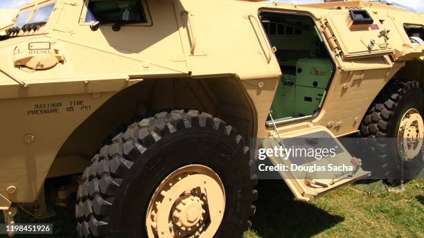 partial view of a military armored personnel vehicle - véhicule blindé photos et images de collection
