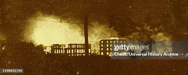 Photograph of Guernica on fire after the bombing.