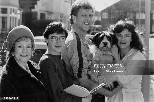 Actors Beryl Reid , Gian Sammarco, Stephen Moore 1937 - 2019), Julie Walters, holding a dog, co-stars in television series "The Secret Diary of...