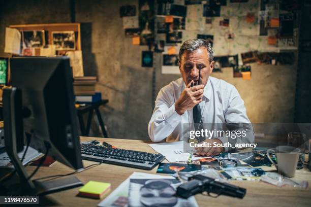 detective with walkie-talkie - chief technology officer stock pictures, royalty-free photos & images