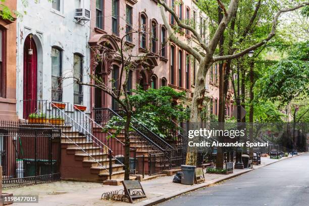 calm street in west village, new york city, usa - greenwich village stock-fotos und bilder