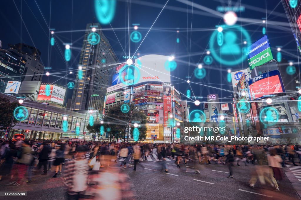 People and technology concept,Global communication icon with network connections line above crowded people walking .Internet of Things And smart city concept,Technology-Futuristic concept