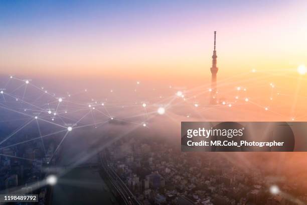 aerial view of tokyo city with networking connections line,global communications and technology concept,data and smart city and internet of things  concept,futuristic concept - data city stock-fotos und bilder