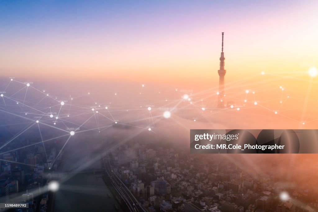 Aerial view of Tokyo city with networking connections line,global communications and Technology concept,Data and smart city and Internet of Things  concept,Futuristic concept