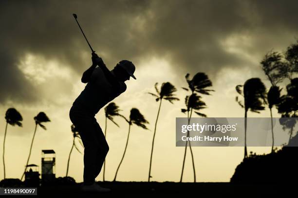 Brandt Snedeker of the United States plays his shot from the 11th tee during the first round of the Sony Open in Hawaii at the Waialae Country Club...