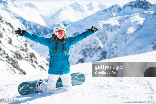 ski holidays - woman snowboarding stock pictures, royalty-free photos & images