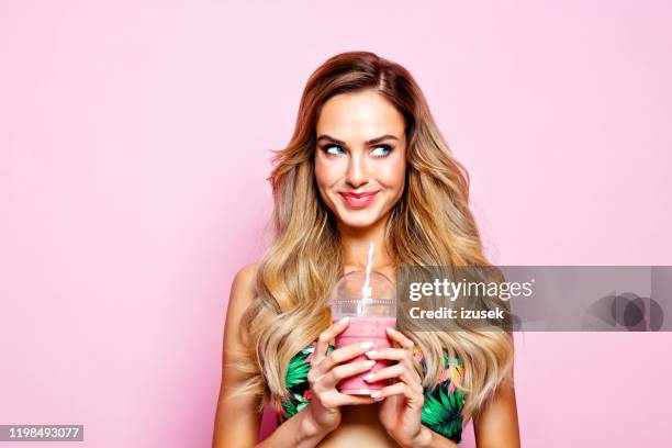 summer portrait of young blonde woman holding smoothie - hot female models stock pictures, royalty-free photos & images