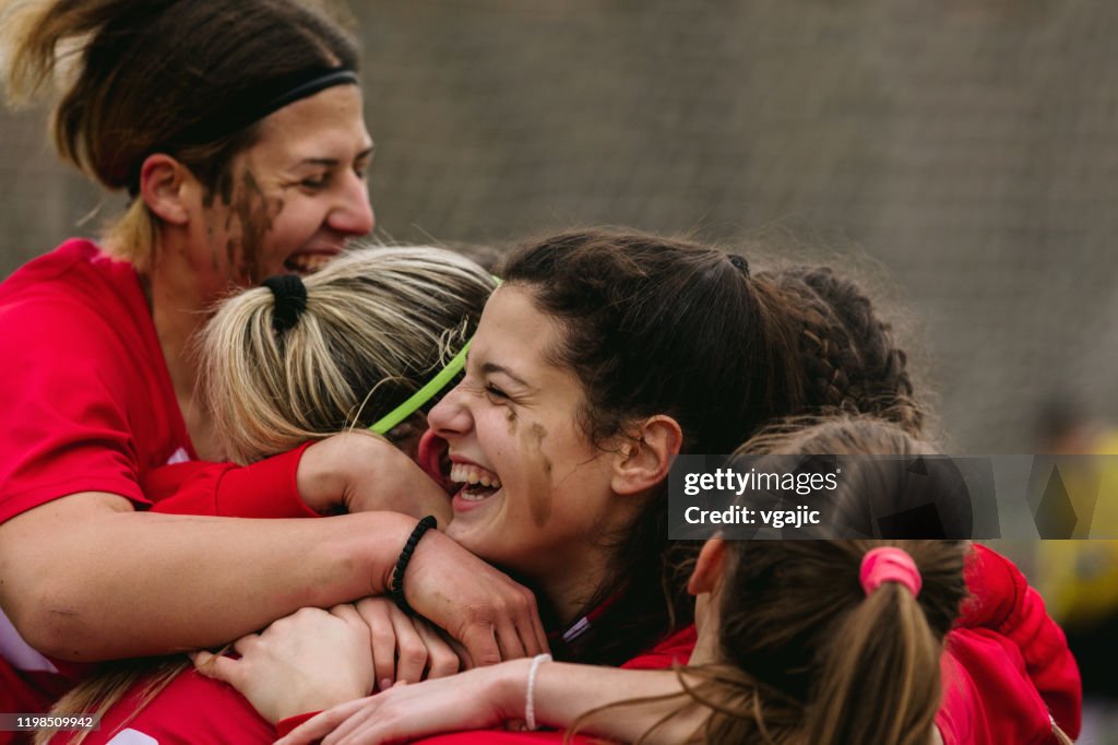 Happy Female Soccer Players Celebrating Goal