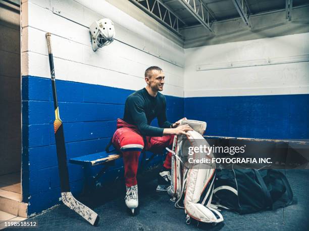 pro hockey goalie after the training - hockey ice stock pictures, royalty-free photos & images