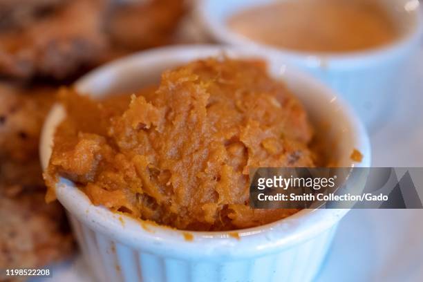 Close-up of traditional American South dish of mashed sweet potatoes or yams at Angeline's Louisiana Kitchen, a cajun restaurant in the North...