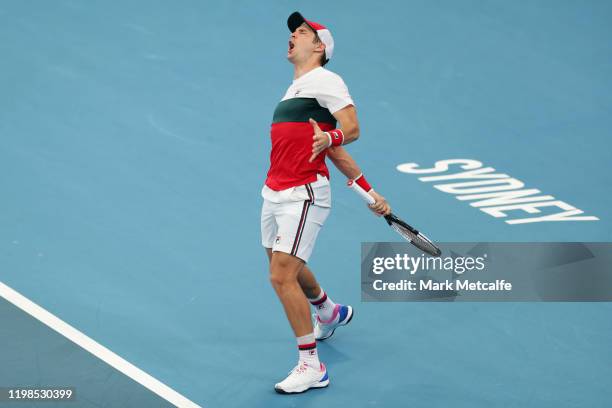 Dusan Lajovic of Serbia celebrates winning match point during his quarter final singles match against Felix Auger Aliassime of Canada during day...