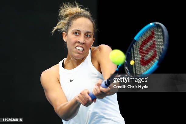 Madison Keys of the United States plays a backhand in her match against Danielle Collins of the United States in the quarter final match during day...