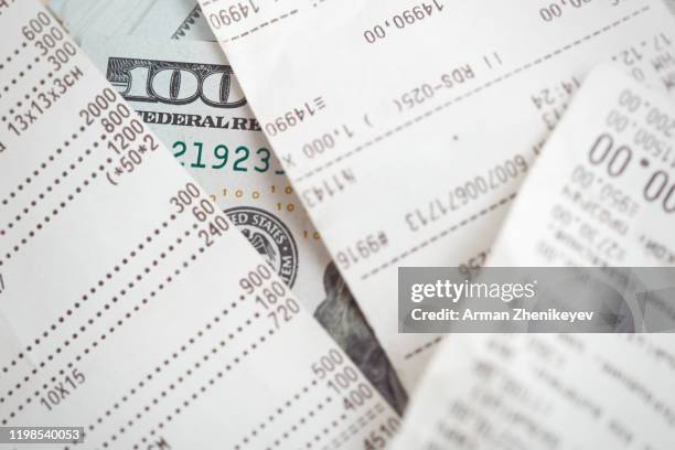 financial receipt and us dollars - adding machine tape stock pictures, royalty-free photos & images