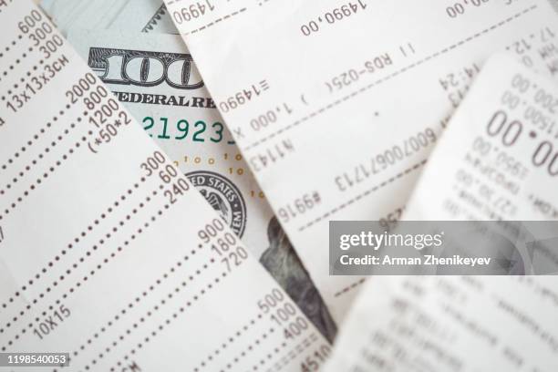 financial receipt and us dollars - adding machine paper stock pictures, royalty-free photos & images