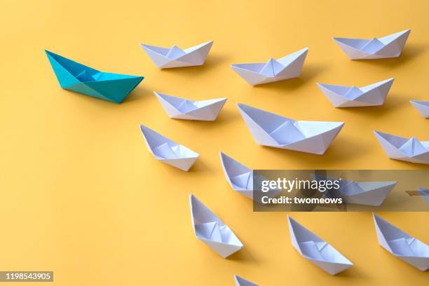 leadership concepts still life. - paper boat stock-fotos und bilder