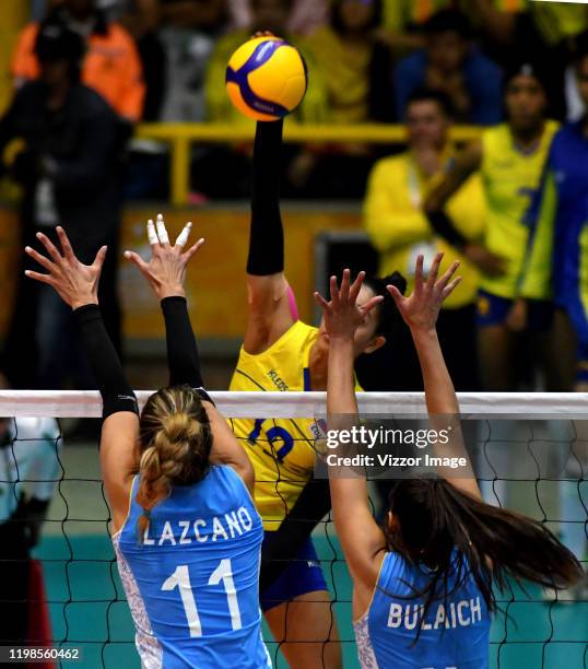 Julieta Lazcano and Daniela Bulaich of Argentina, try to block the ball shot by Amanda Coneo of Colombia, during a match between Argentina and...