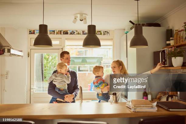 parents of twins have secret superpowers - busy kitchen stock pictures, royalty-free photos & images