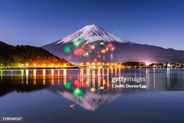 fuji mountain reflection and fireworks in winter, kawaguchiko lake, japan - lake kawaguchi imagens e fotografias de stock