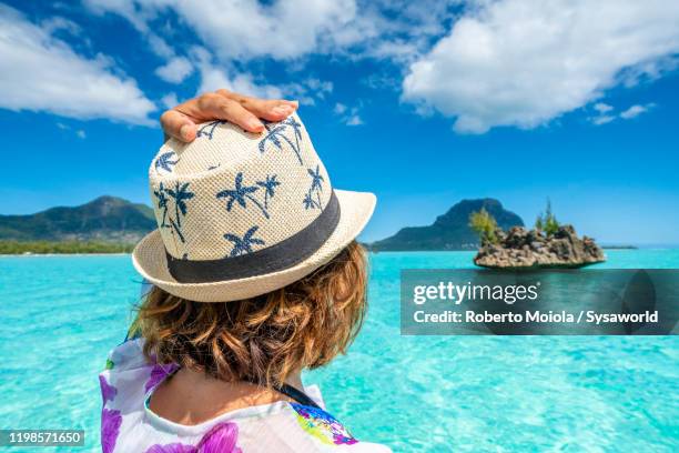 beautiful woman on tour boat, indian ocean, mauritius - mauritius beach stock-fotos und bilder