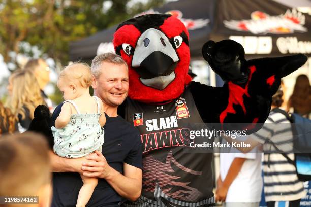 Hawks supporters pose with Tomma Hawk the mascot as they arrive for the round 15 NBL match between the Illawarra Hawks and the Perth Wildcats at the...