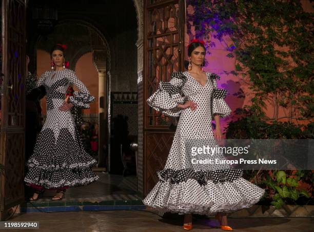 Seville, SPAIN Models wear flamenco dress by Lina 1960 Flamenco Fashion Company for the celebration of it´s 60th anniversary with a parade ‘60 años...