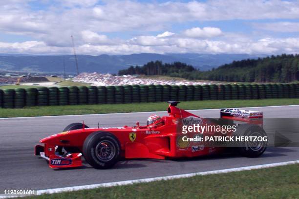 Irish Ferrari driver Eddie Irvine speeds his car on the racetrack during the third free practice session, in Spielberg 24 July 1999, on the eve of...
