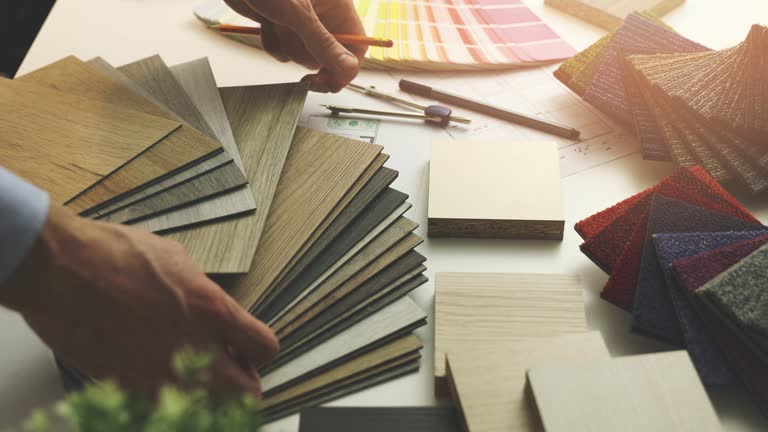 interior designer choosing flooring and furniture materials from ...