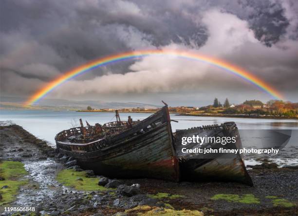 wrecked fishing boats beached on shore at salen, isle of mull. - november landscape stock pictures, royalty-free photos & images