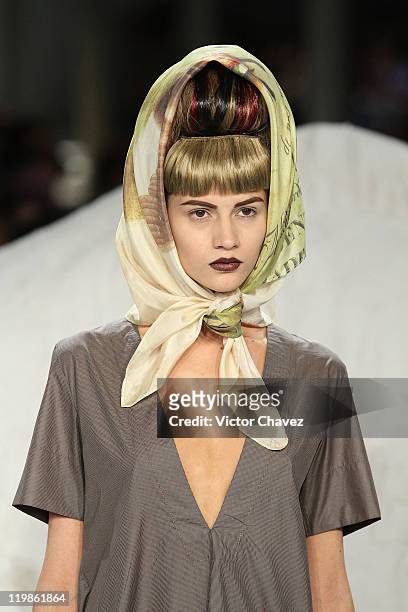 Model walks the runway at the Olga Piedrahita fashion show during Colombiamoda 2011 day one at Antigua Bodega Coltejer on July 25, 2011 in Medellin,...