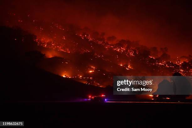 Rural FIre Service firefighters conduct property protection patrols at the Dunn Road fire on January 10, 2020 in Mount Adrah, Australia. NSW is...