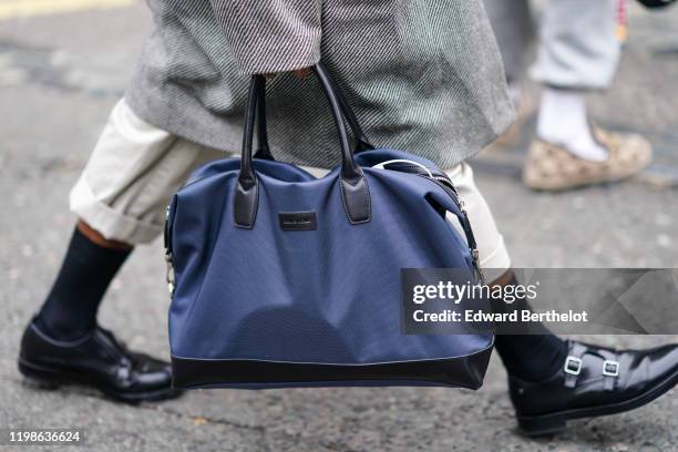 Blue Remus Uomo bag is seen, during London Fashion Week Men's January 2020 on January 05, 2020 in London, England.